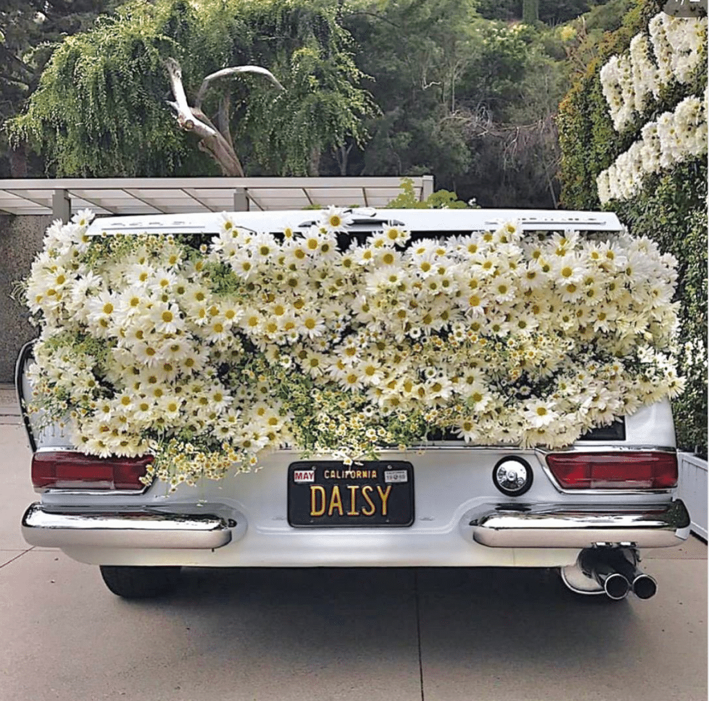 car with flowers in trunk