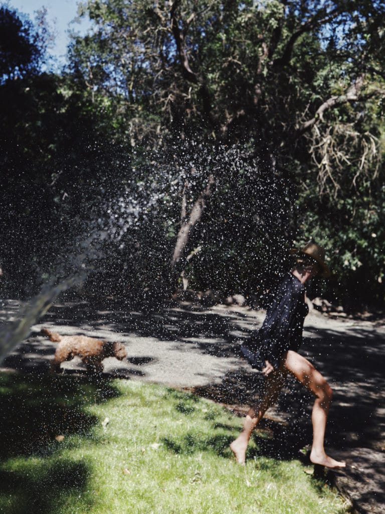 running through sprinkler