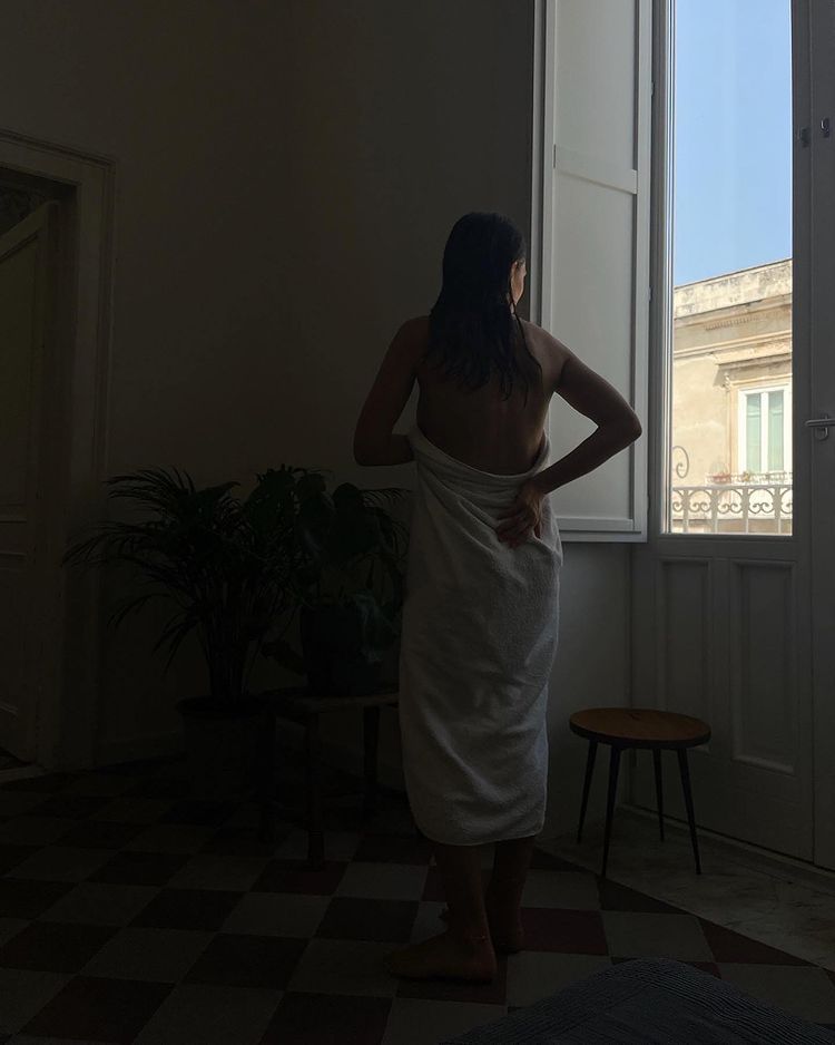 woman standing in window europe