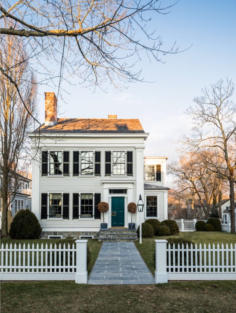 fall house with picket fence