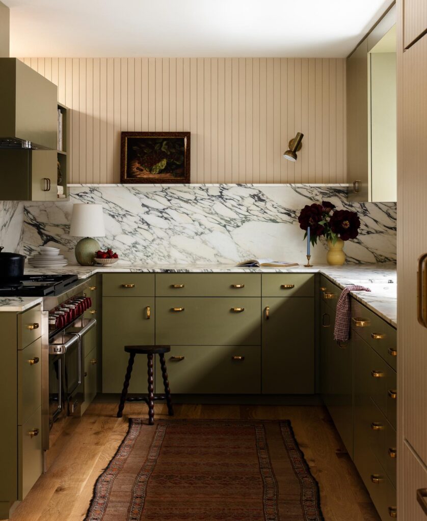 midcentury modern green kitchen with brass pulls and vintage runner