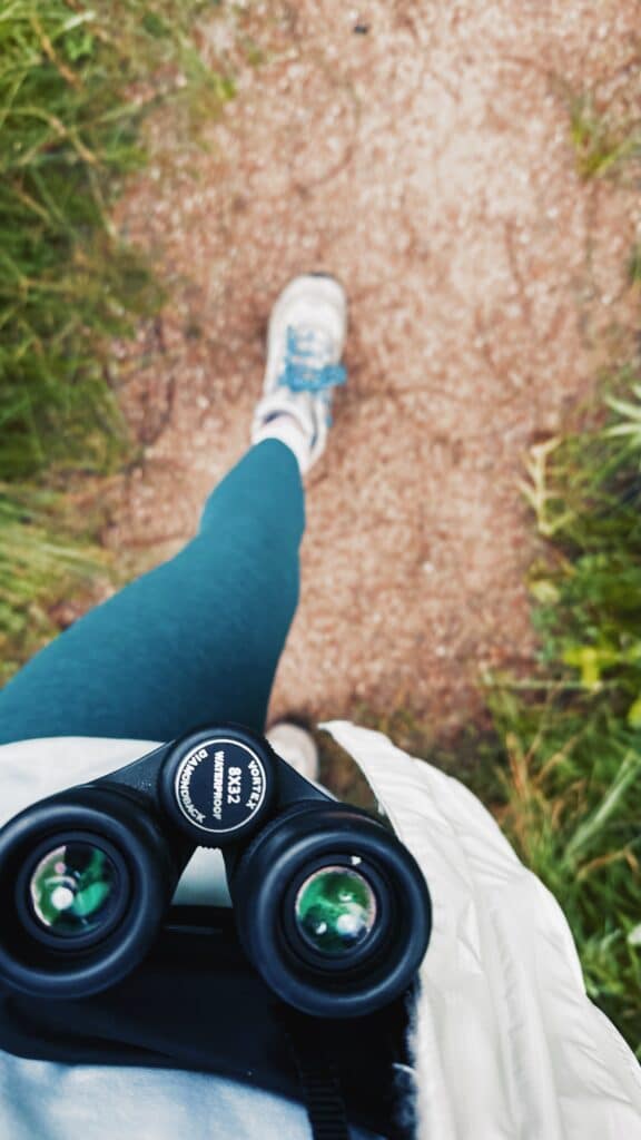 birding binoculars on hike