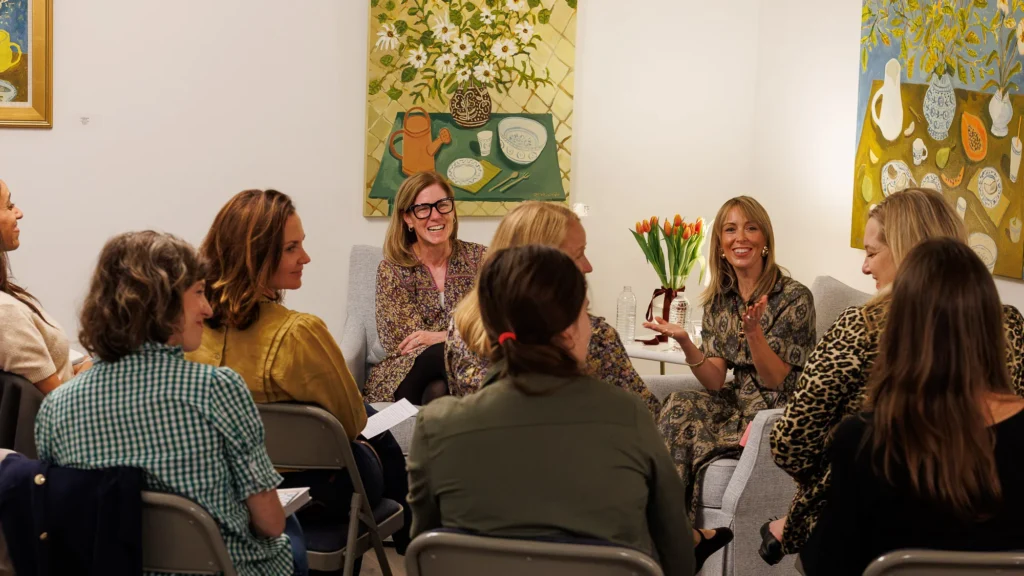 Jen Shoop and Mary Beth Morell speaking with an audience seated around them at Castle Gallery in Middleburg.