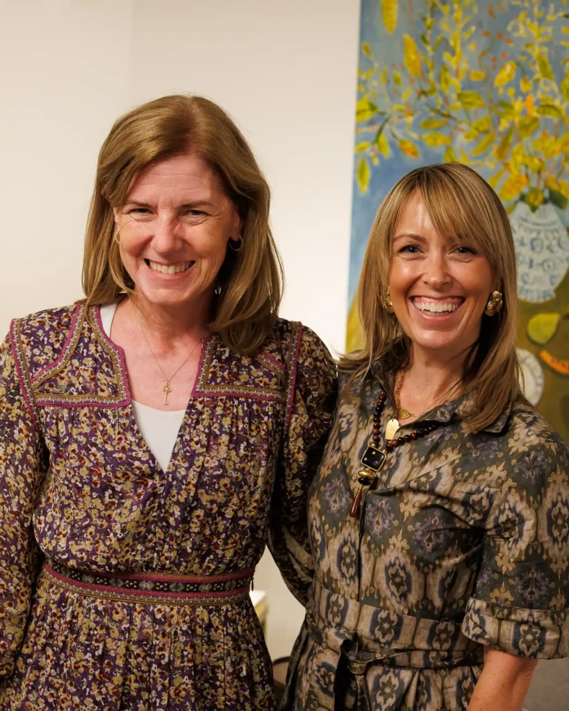 Mary Beth Morell and Jen Shoop smiling together at Castle Gallery in Middleburg.